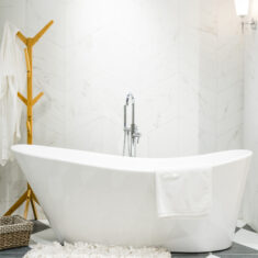 Interior of a contemporary bathroom interior with a white tub and toilet Interior of a contemporary bathroom interior with a white tub and toilet