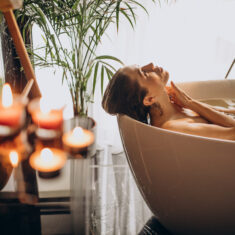 Woman relaxing in bath with bubbles Woman relaxing in bath with bubbles